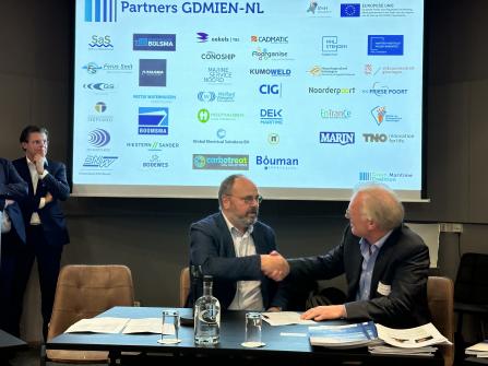 Wilco van Wijck (CEO at Bouman Industries) and Geert Dokter (CEO at Conoship International) sign the agreement for the joint venture.  Image courtesy of Carbotreat Maritime.